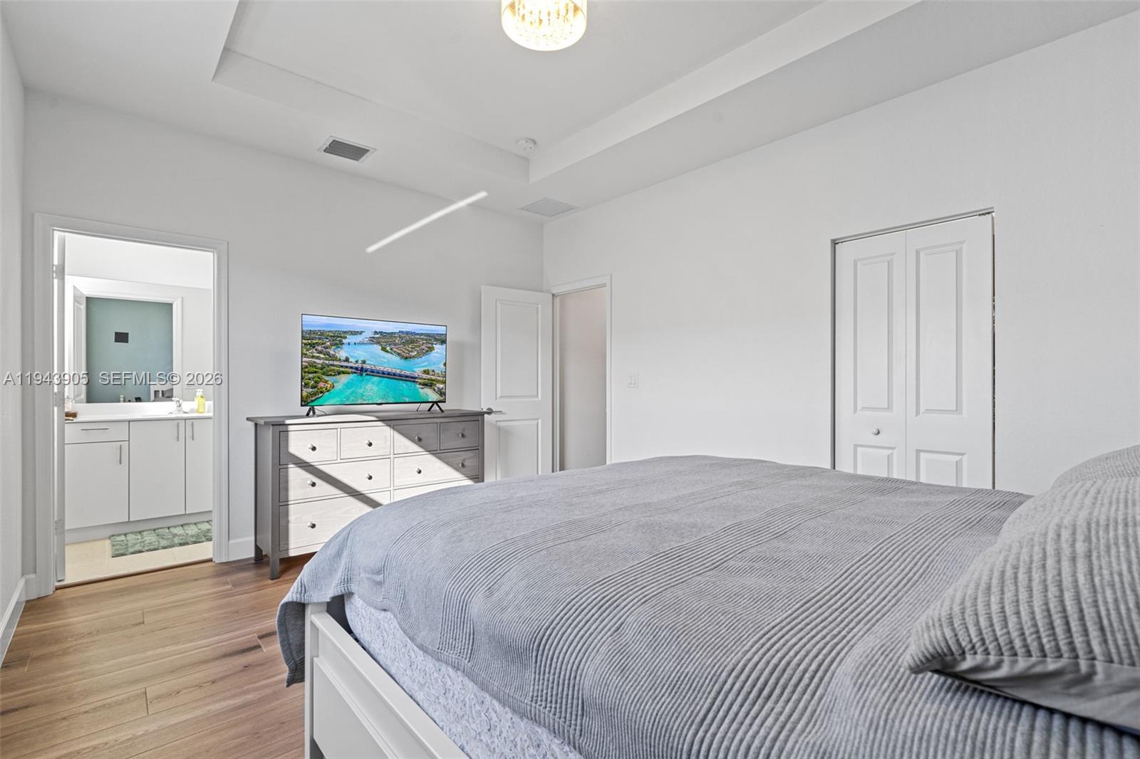 16276 Southwest 291st Street Homestead, FL 33033 - Photo 12 of 22 a spacious bedroom with a bed and a cabinets