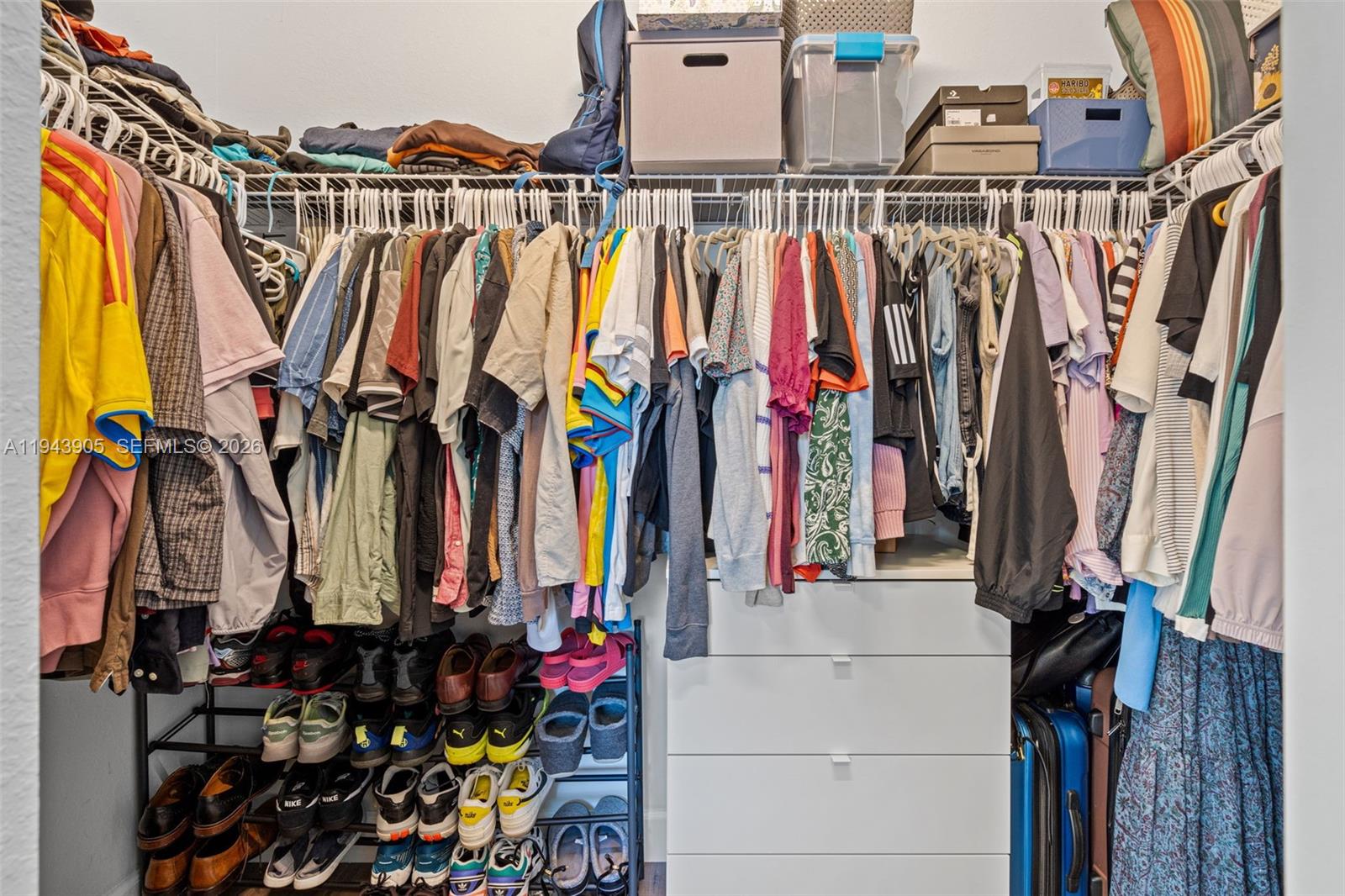 16276 Southwest 291st Street Homestead, FL 33033 - Photo 14 of 22 a view of walk in closet with clothes