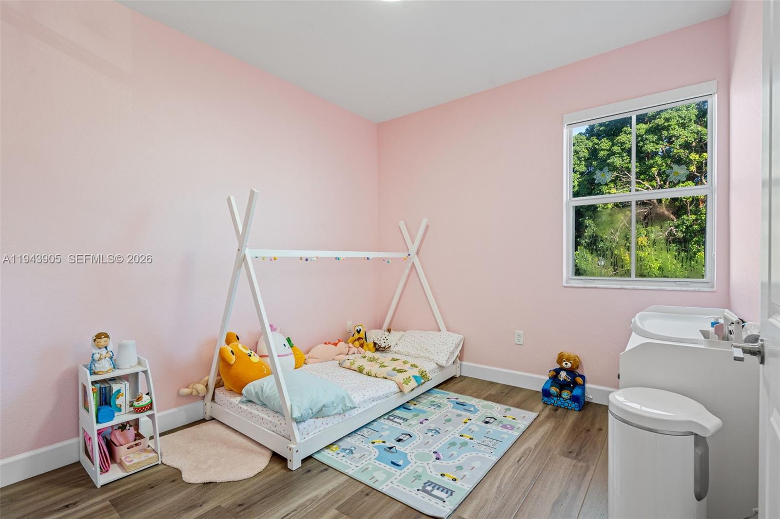 16276 Southwest 291st Street Homestead, FL 33033 - Photo 18 of 22 a bed sitting in a bedroom next to a window