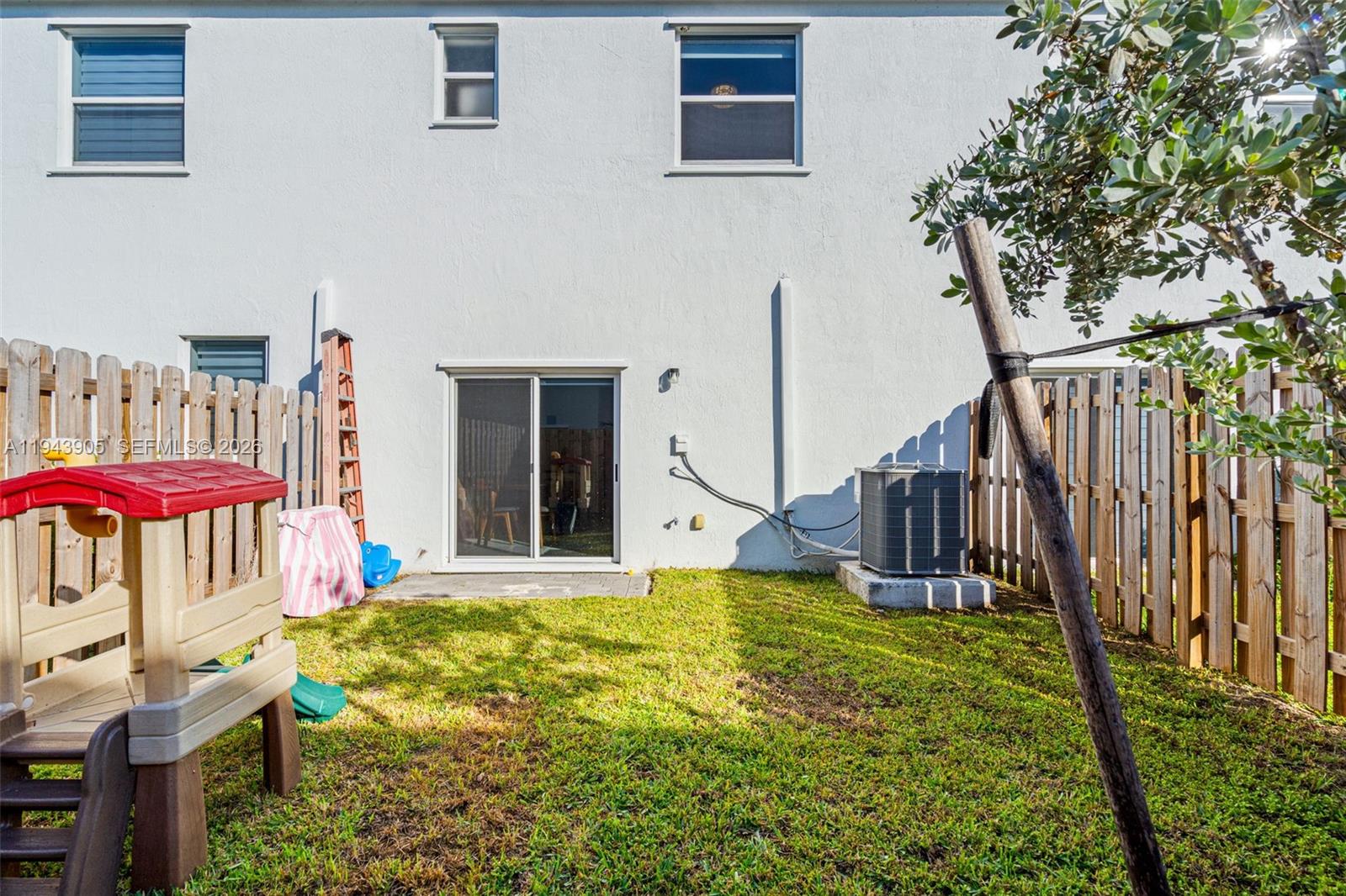 16276 Southwest 291st Street Homestead, FL 33033 - Photo 22 of 22 a view of a house with backyard porch and furniture