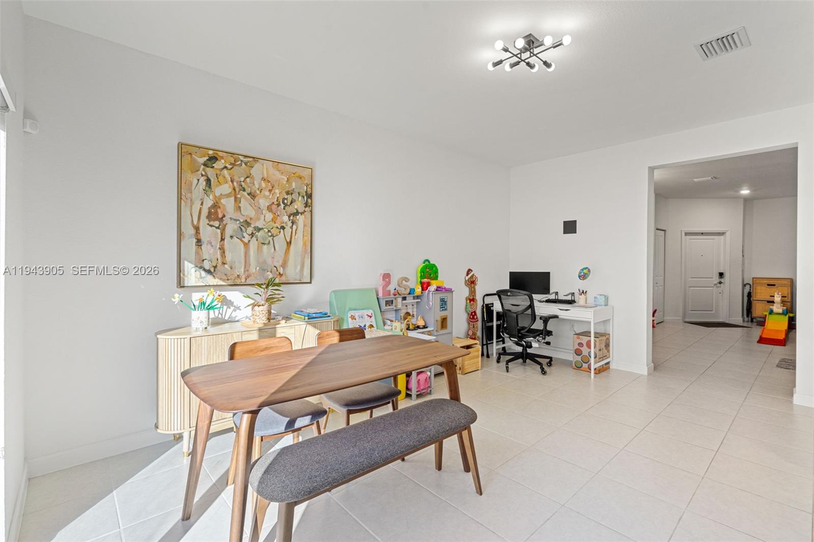 16276 Southwest 291st Street Homestead, FL 33033 - Photo 5 of 22 a view of a workspace with furniture