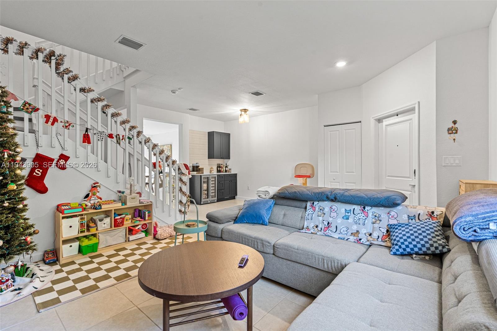 16276 Southwest 291st Street Homestead, FL 33033 - Photo 6 of 22 a living room with furniture and a flat screen tv