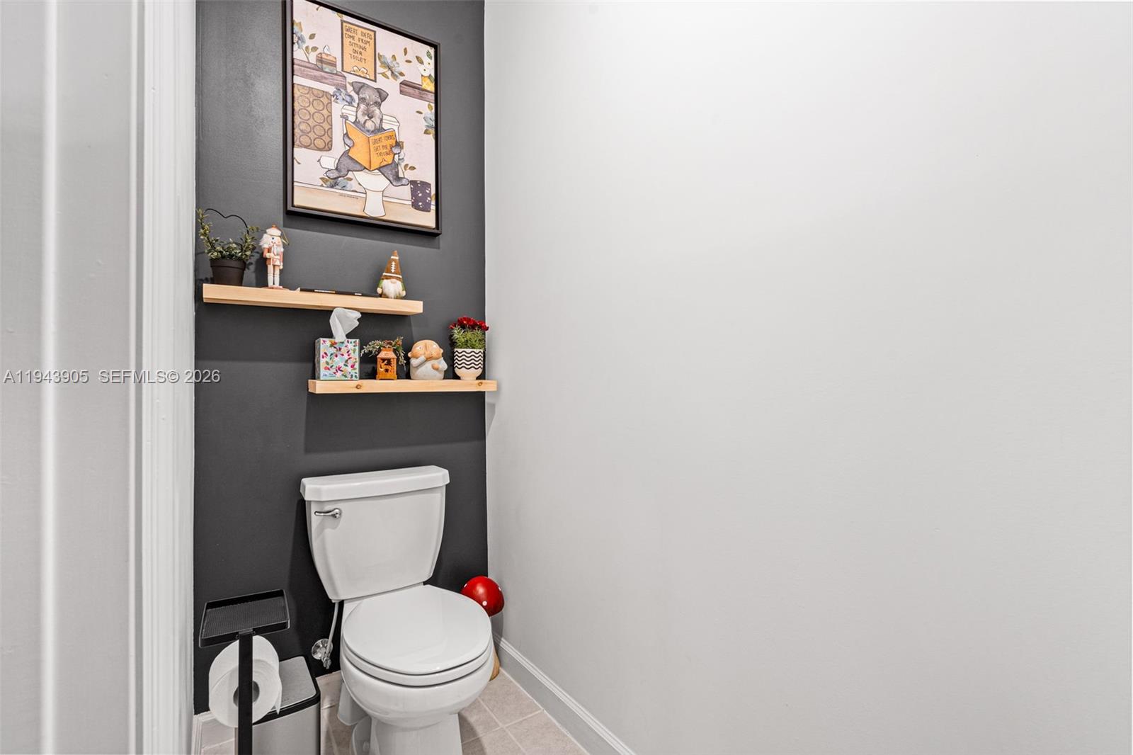 16276 Southwest 291st Street Homestead, FL 33033 - Photo 9 of 22 a white toilet sitting next to a bathroom sink and vanity
