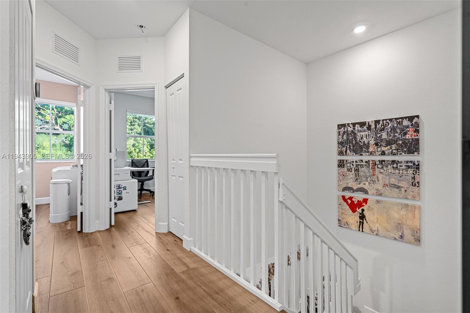 16276 Southwest 291st Street Homestead, FL 33033 - Photo 10 of 22 a view of a hallway to a livingroom with wooden floor and entryway