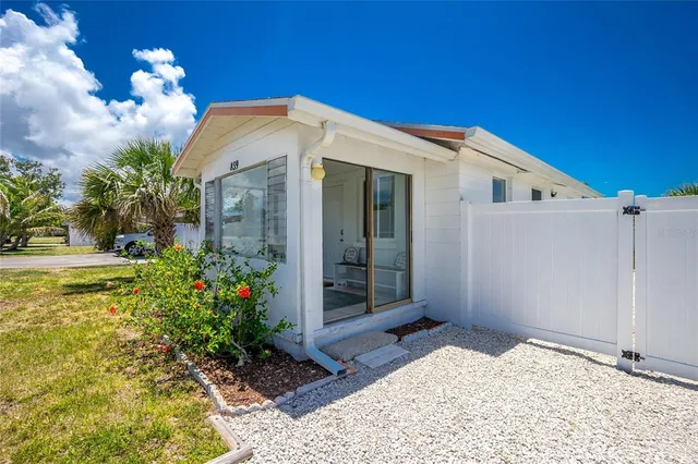 a room with furniture and a large window