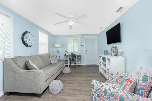 a kitchen with sink cabinets and wooden floor