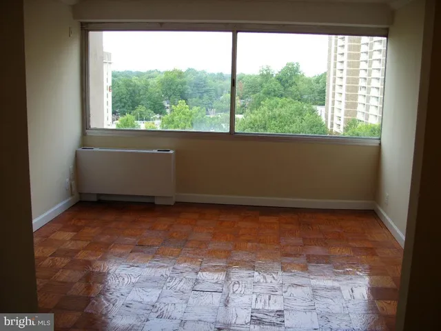 a view of a room with a large window