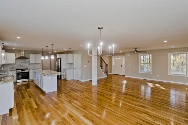 a large kitchen with a large counter top appliances and cabinets