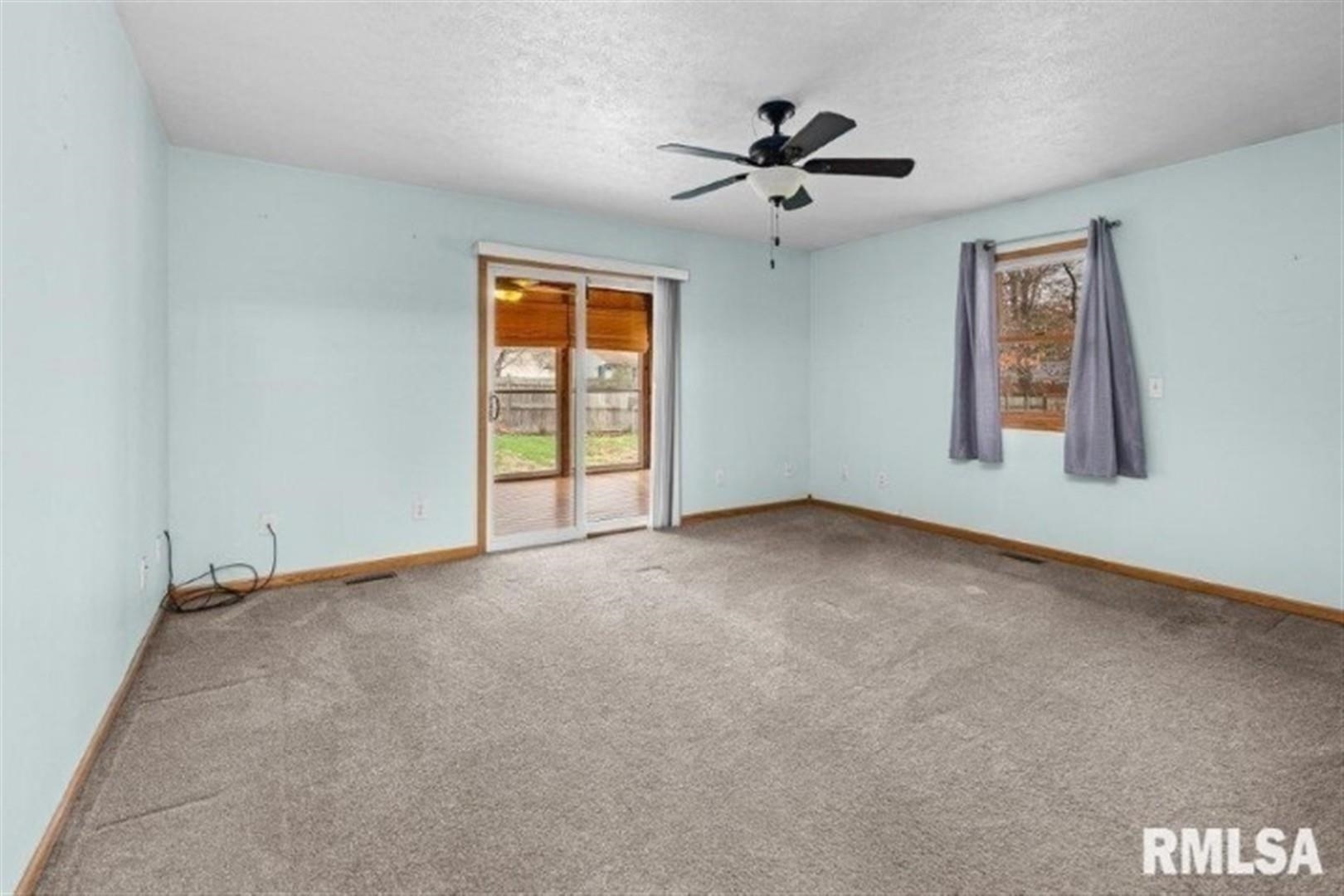 304 7th Street Hampton, IL 61256 - Photo 10 of 35 a view of an empty room with a window