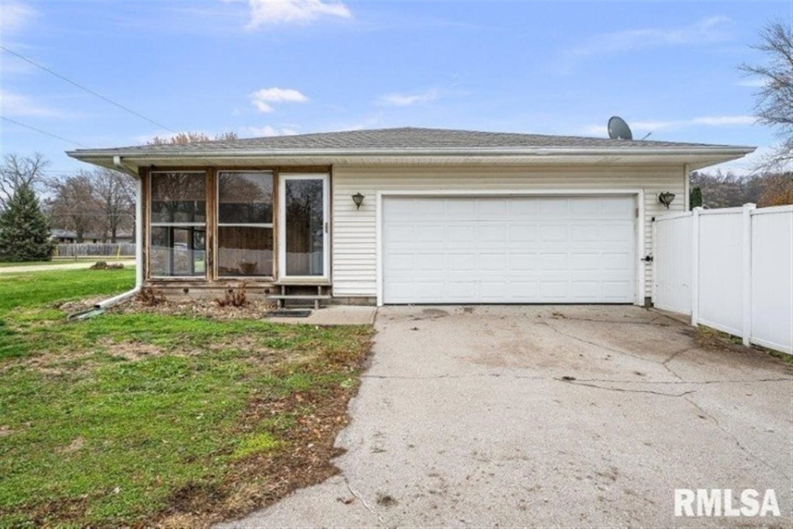 304 7th Street Hampton, IL 61256 - Photo 27 of 35 front view of a house with a yard