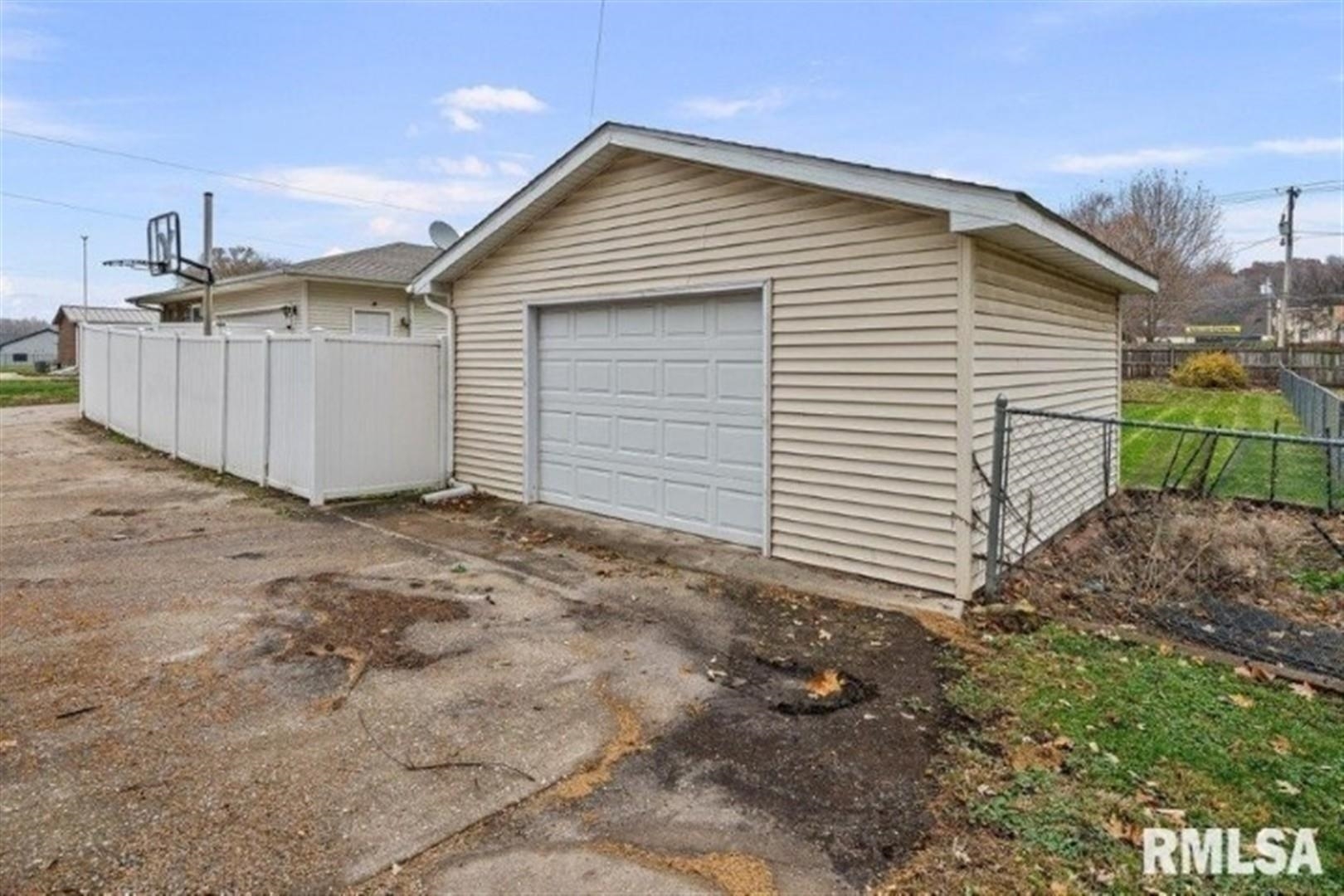 304 7th Street Hampton, IL 61256 - Photo 28 of 35 a view of a house with a backyard