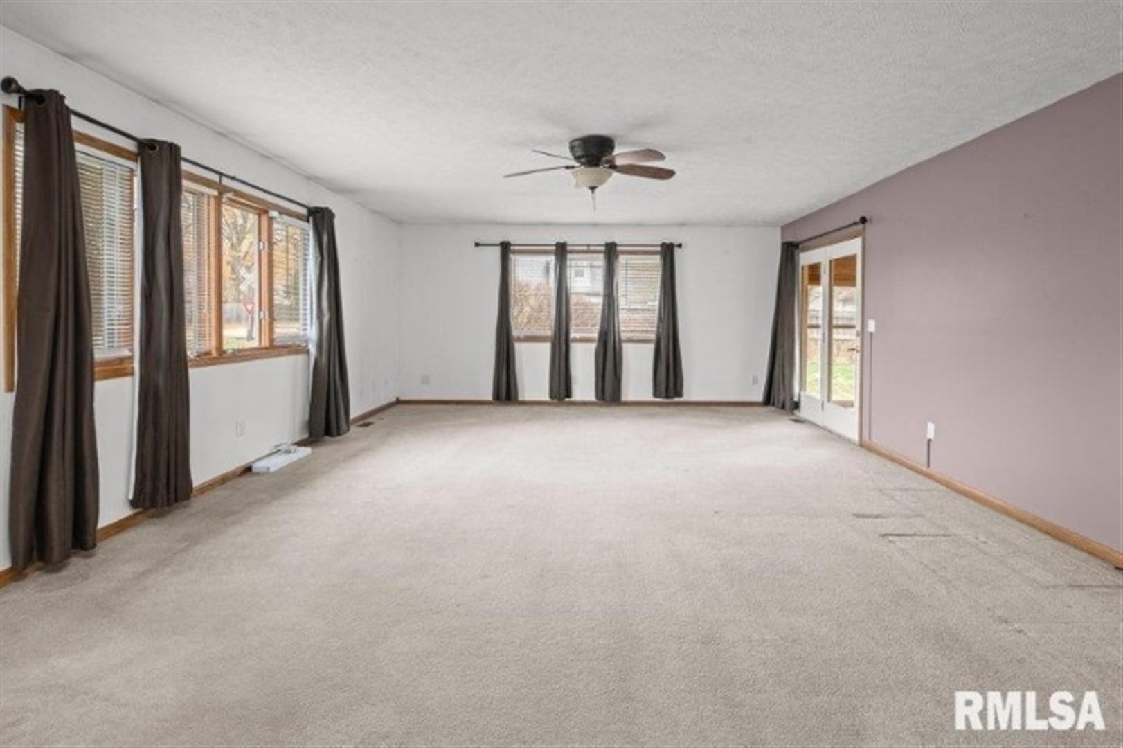 304 7th Street Hampton, IL 61256 - Photo 29 of 35 a view of an empty room with a window