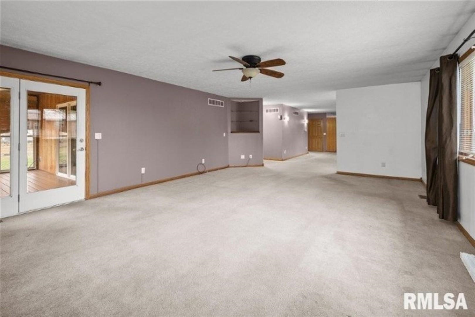 304 7th Street Hampton, IL 61256 - Photo 30 of 35 a view of an empty room with a window