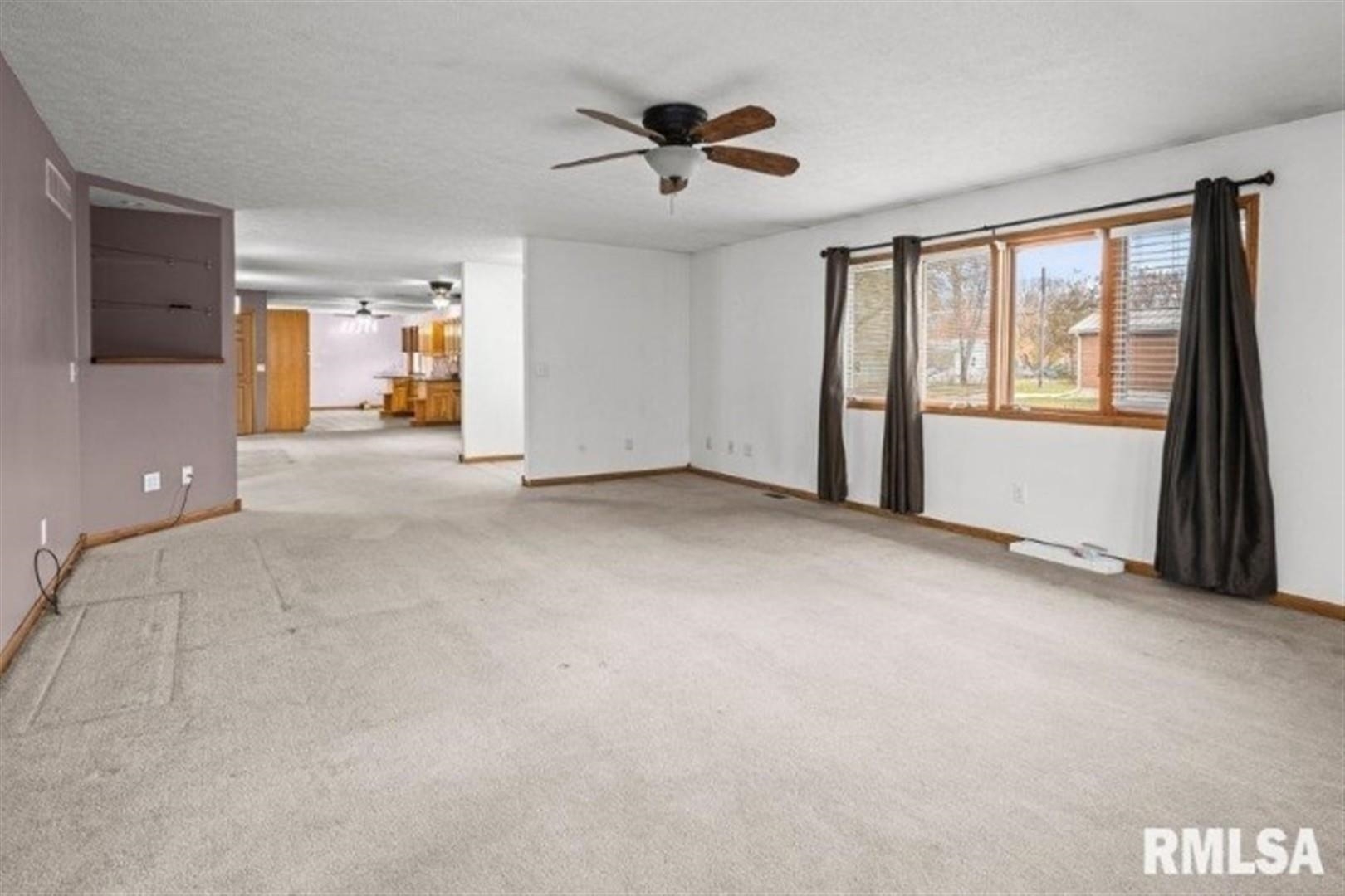 304 7th Street Hampton, IL 61256 - Photo 31 of 35 a view of an empty room with a window