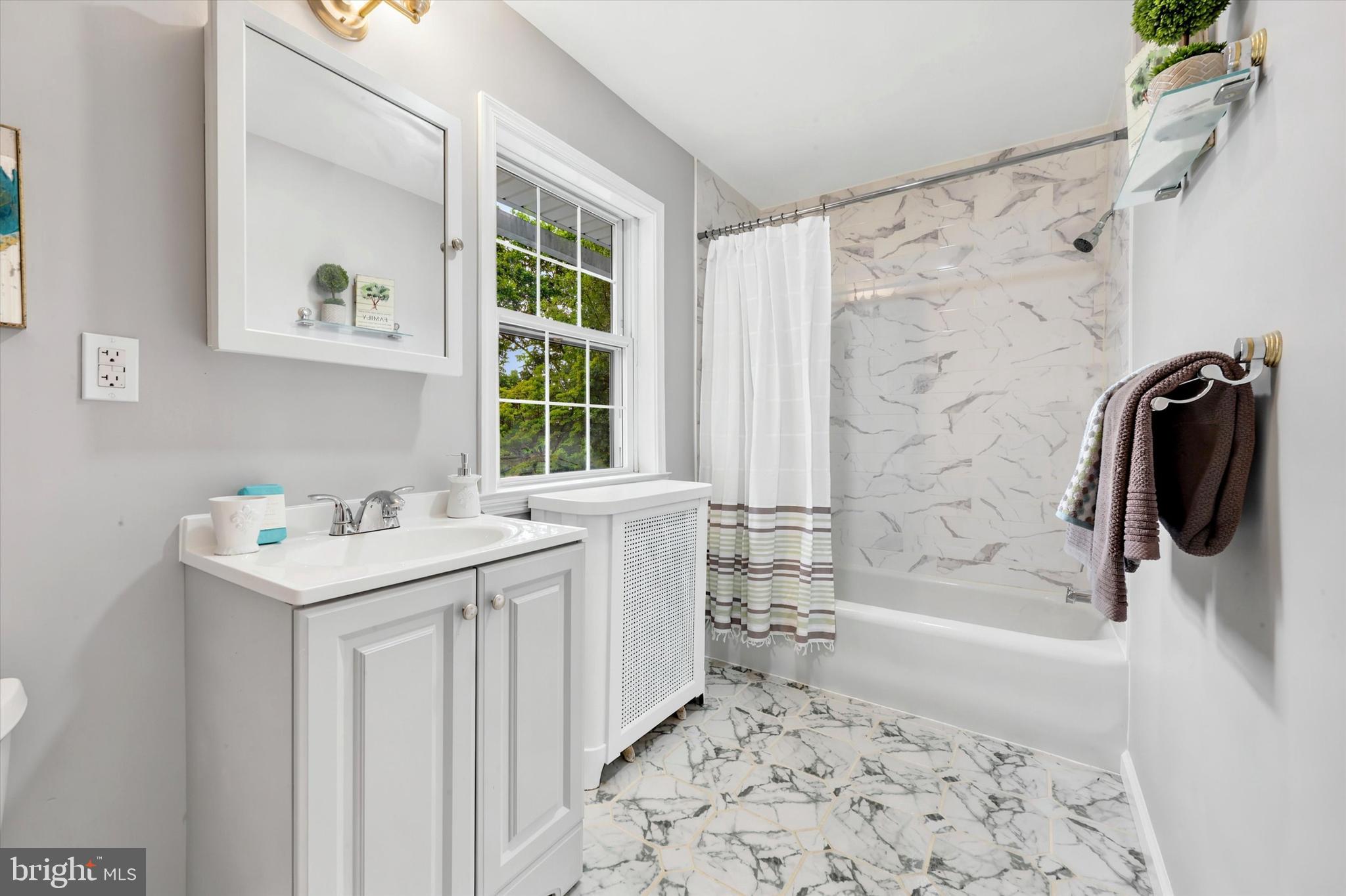 7208 Hilltop Road Upper Darby, PA 19082 - Photo 14 of 28 a bathroom with a sink a toilet and shower