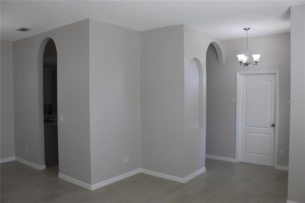 12503 Sparkleberry Road Tampa, FL 33626 - Photo 6 of 8 an empty room with chandelier fan
