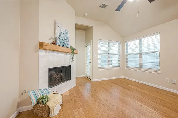a bedroom with a bed and a fireplace