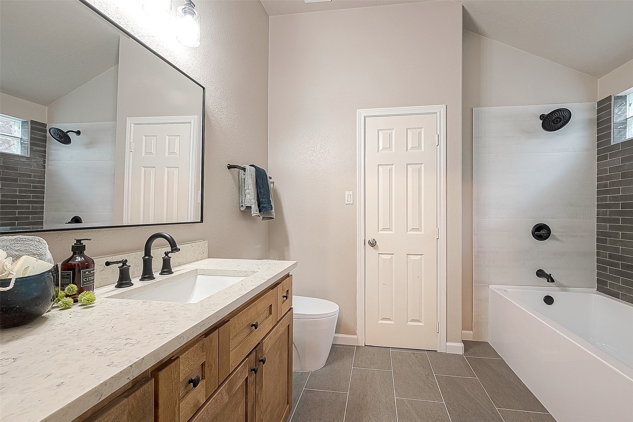 2910 Crescent Bend Road Spring, TX 77388 - Photo 14 of 30 a bathroom with a tub sink double vanity and a mirror