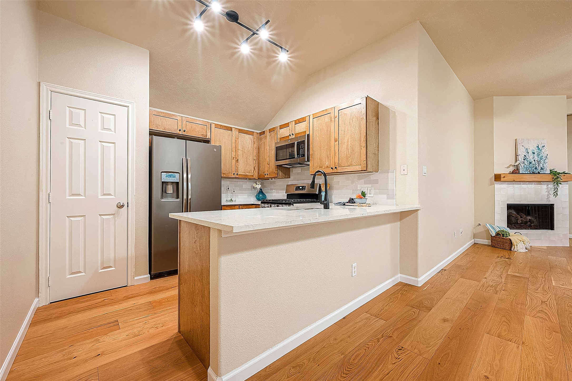2910 Crescent Bend Road Spring, TX 77388 - Photo 2 of 30 a kitchen with kitchen island granite countertop a stove a refrigerator a sink dishwasher with a dining table and chairs