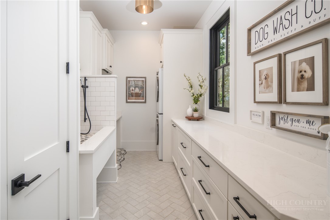 1236 Ninebark Road Boone, NC 28607 - Photo 15 of 50 a spacious bathroom with a double vanity sink a mirror and a shower