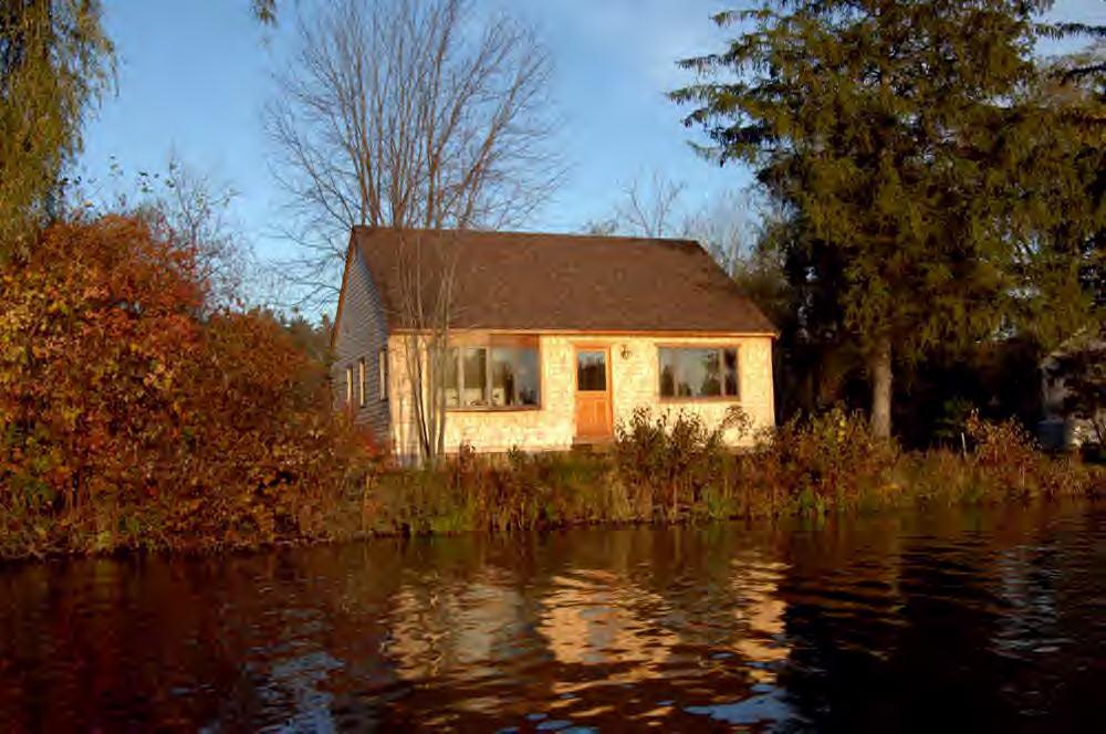 a view of house with a lake view