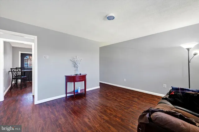 a room with furniture and a wooden floor