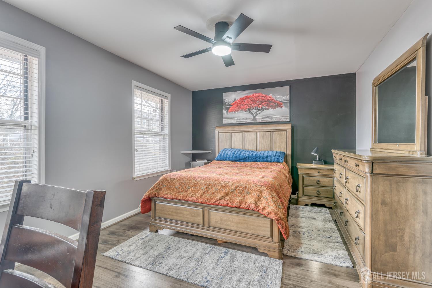 105 Neilly Court Old Bridge, NJ 08857 - Photo 11 of 24 a bedroom with a bed and a couch