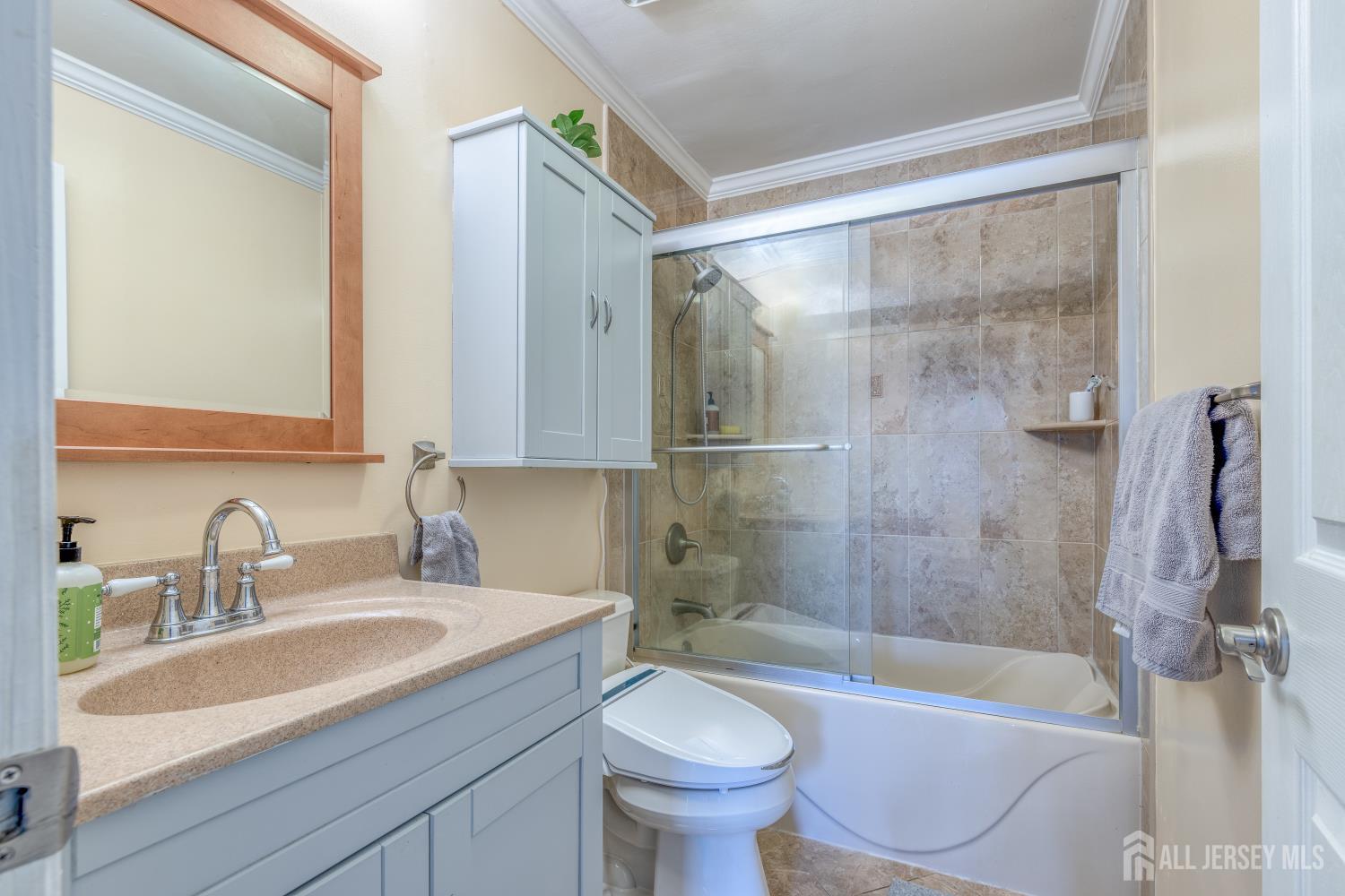 105 Neilly Court Old Bridge, NJ 08857 - Photo 16 of 24 a bathroom with a sink toilet bathtub and shower