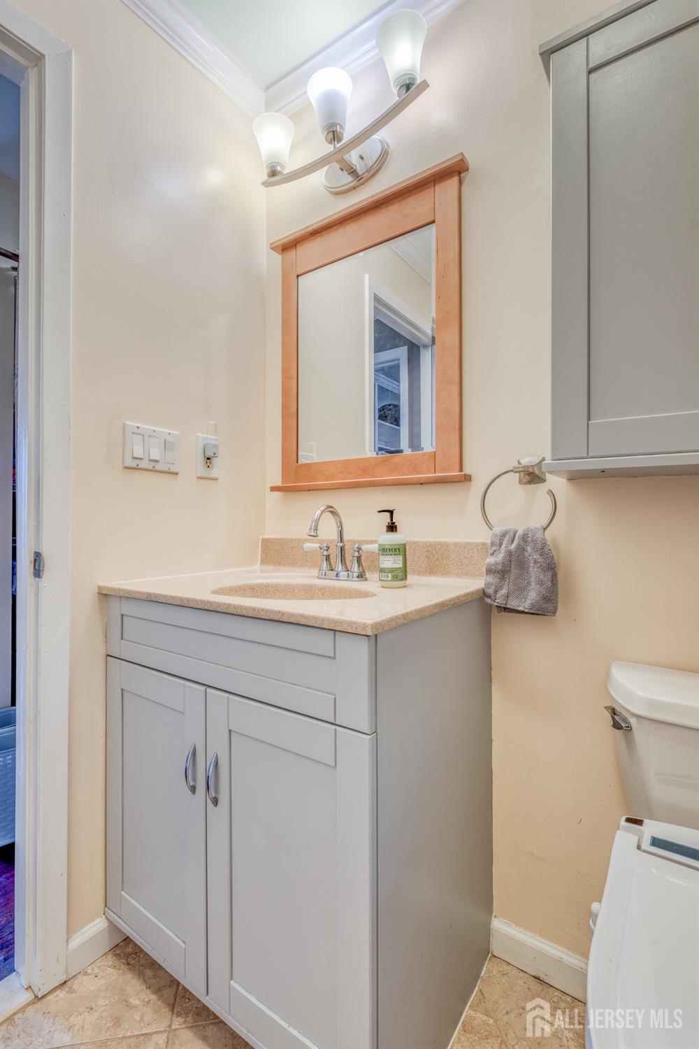 105 Neilly Court Old Bridge, NJ 08857 - Photo 17 of 24 a bathroom with a sink vanity and toilet