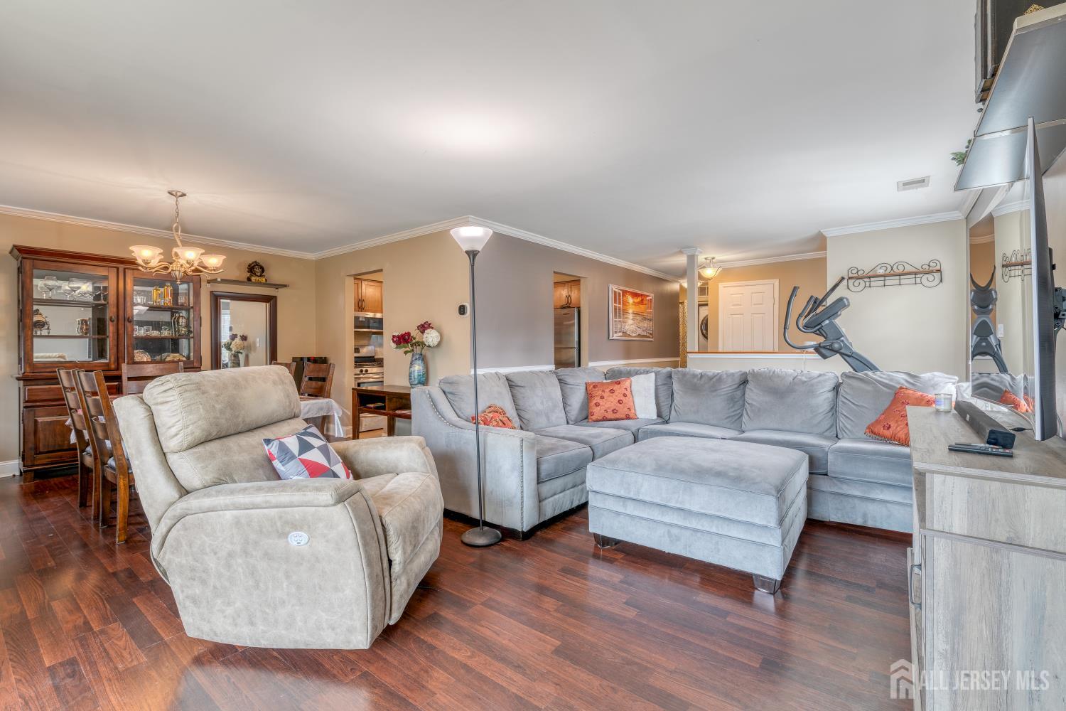 105 Neilly Court Old Bridge, NJ 08857 - Photo 5 of 24 a living room with furniture and a flat screen tv