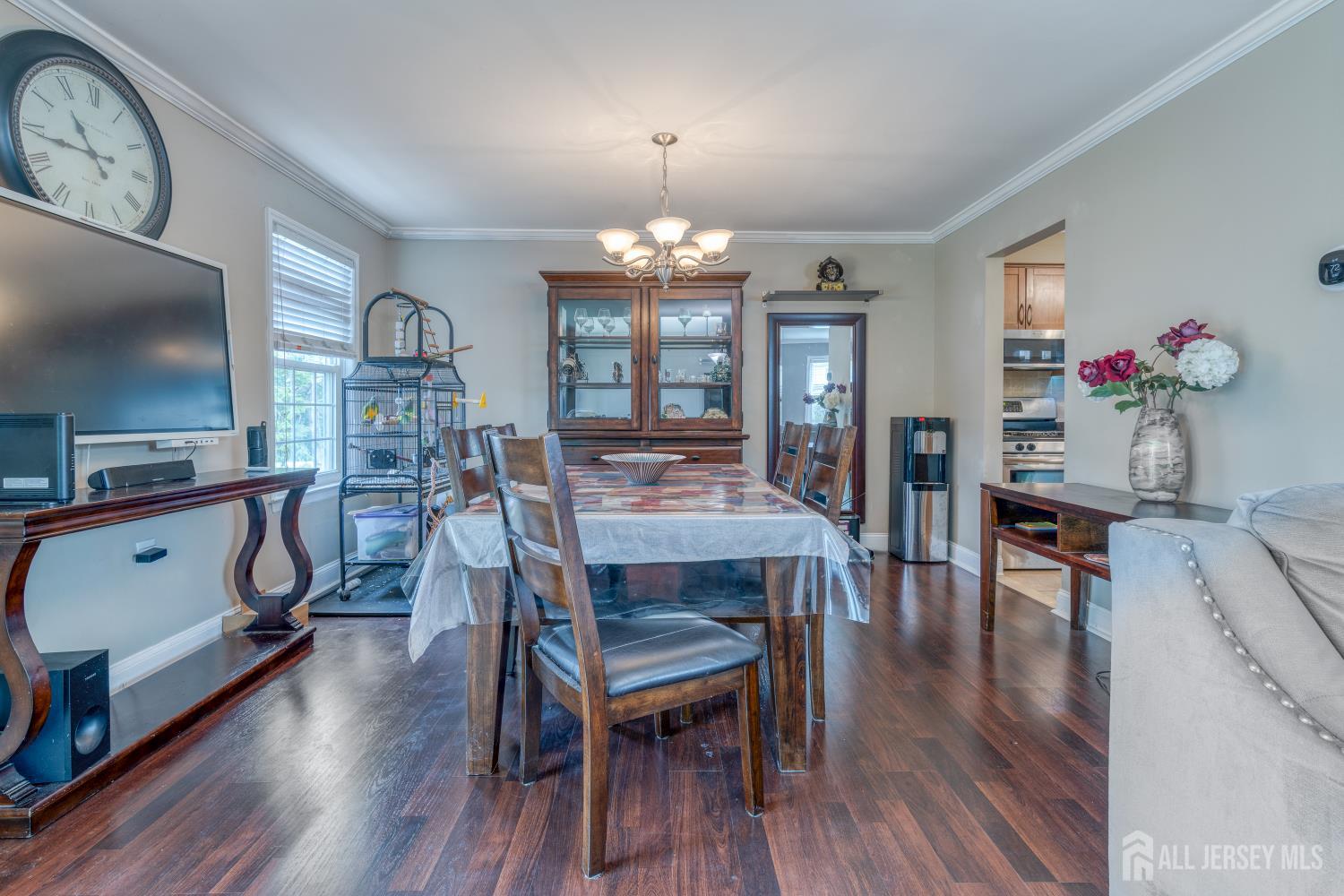 105 Neilly Court Old Bridge, NJ 08857 - Photo 6 of 24 a view of a a dining room with furniture window and wooden floor