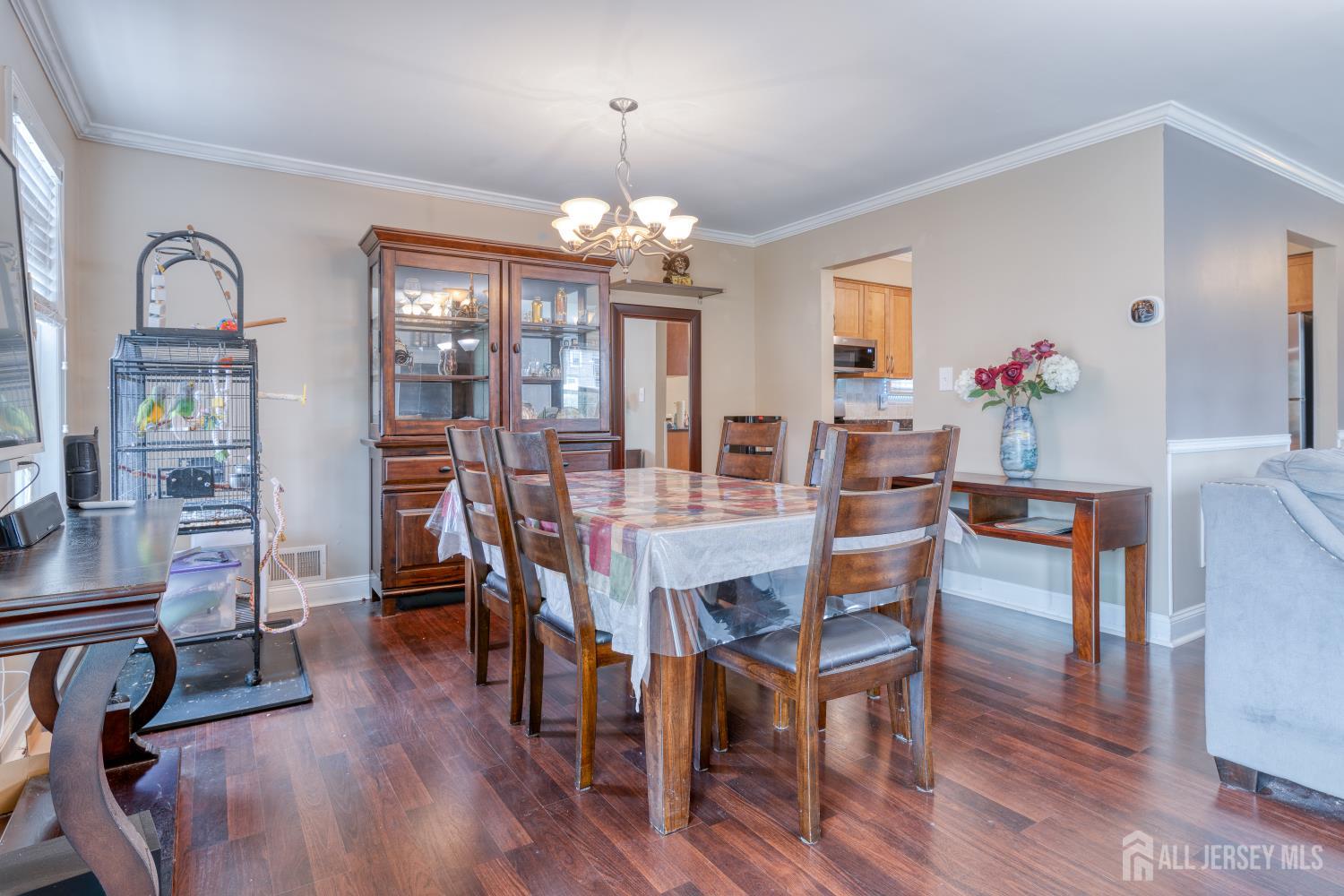 105 Neilly Court Old Bridge, NJ 08857 - Photo 7 of 24 a view of a dining room with furniture wooden floor and chandelier