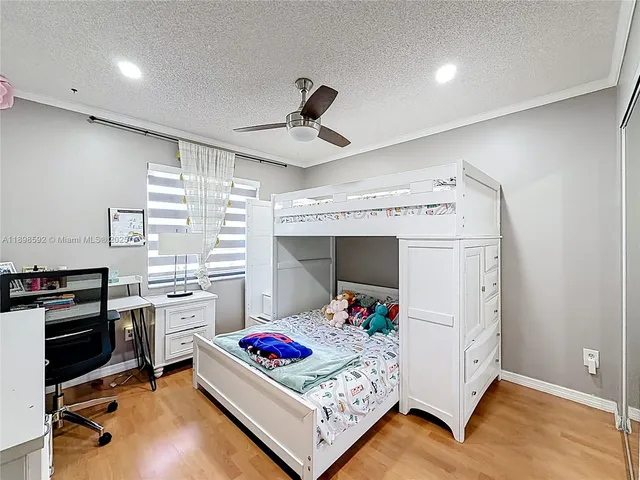 a living room with hard wood flooring and furniture