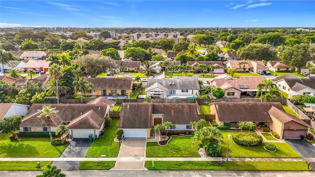 an aerial view of a house with a garden