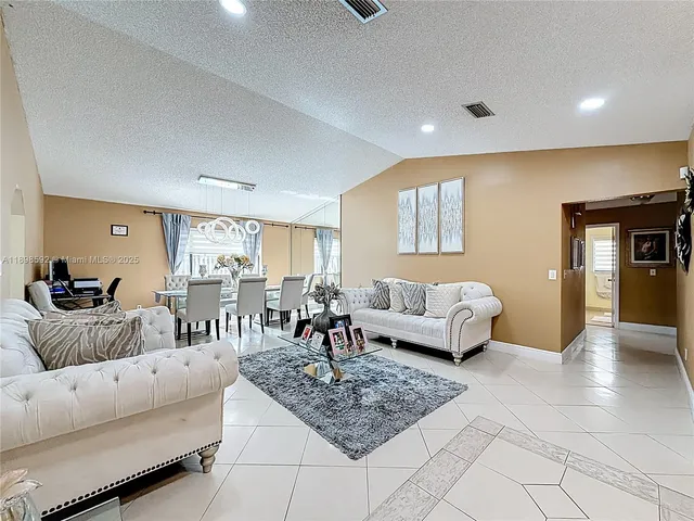 a living room with furniture and a couch