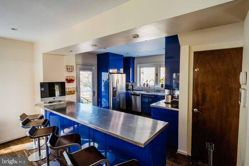 5232 Macomb Street Northwest Washington, DC 20016 - Photo 5 of 5 a view of a dining room with furniture