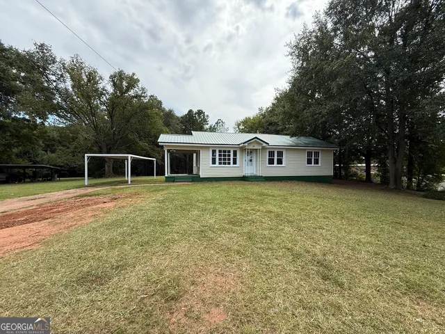 a house with trees in the background