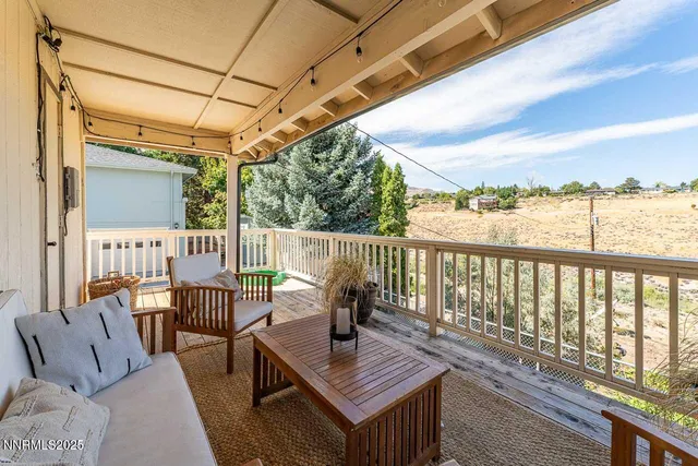a view of balcony with wooden floor