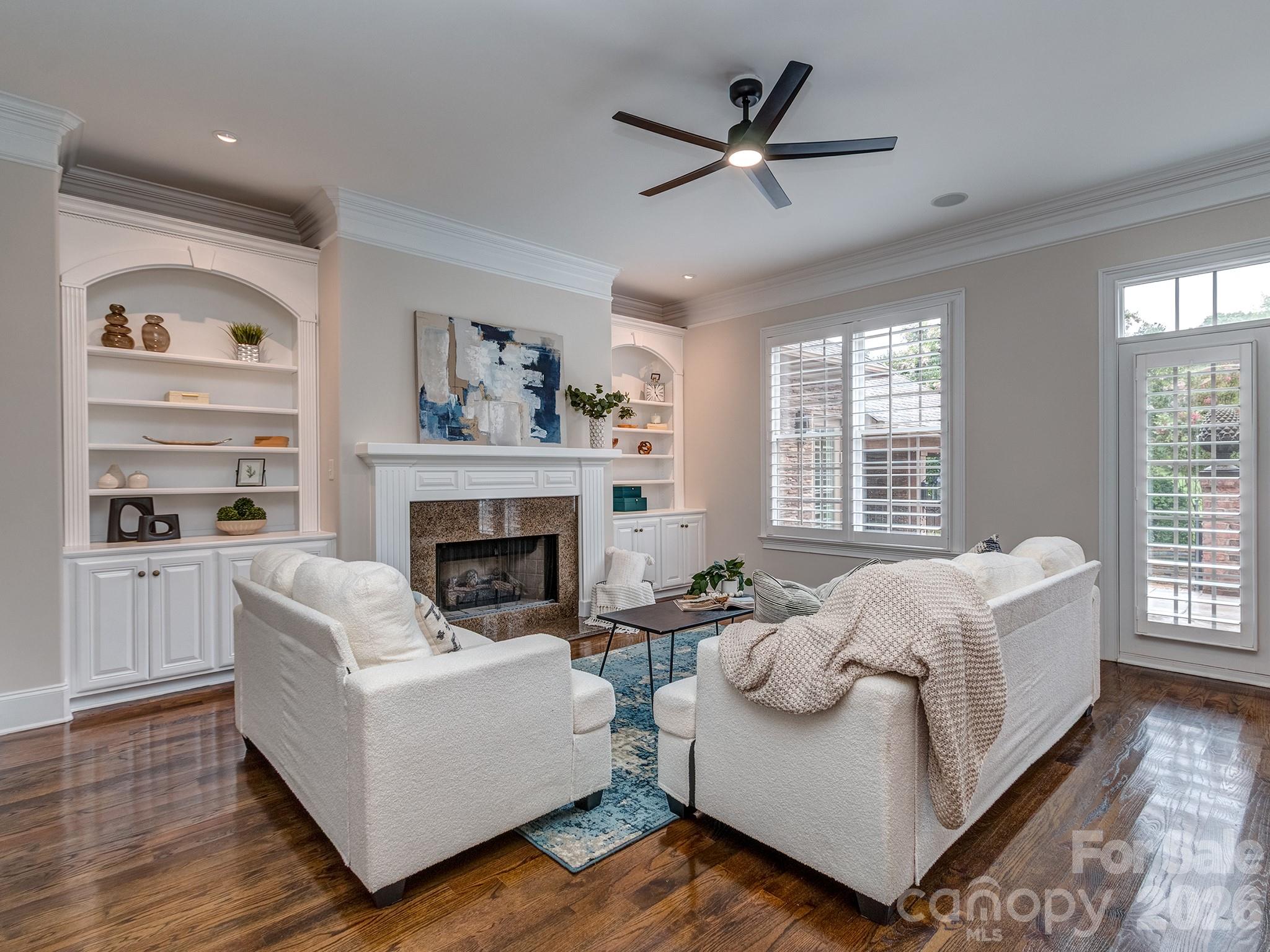 8208 Wingard Road Waxhaw, NC 28173 - Photo 12 of 41 a living room with furniture and a fireplace