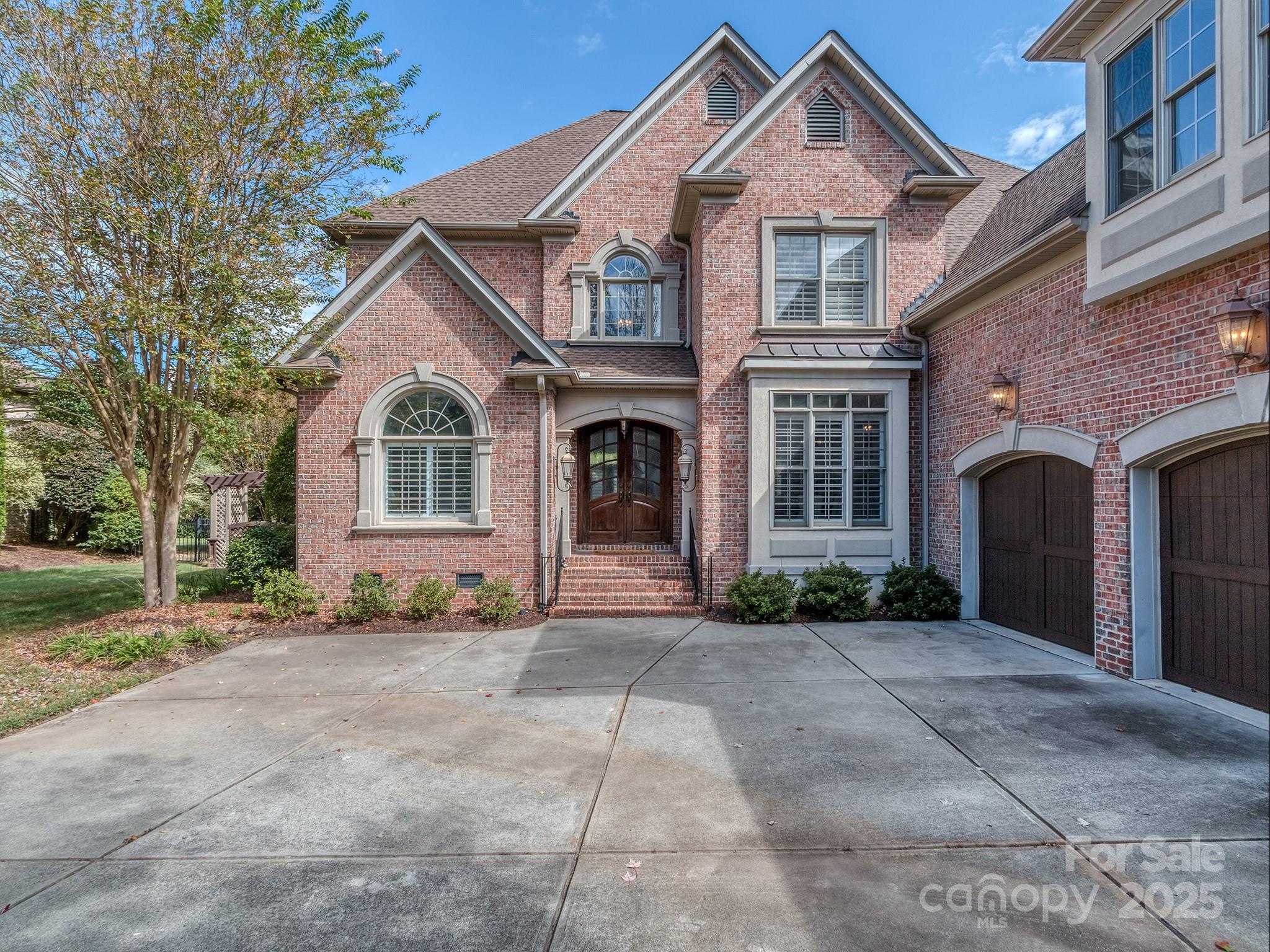 8208 Wingard Road Waxhaw, NC 28173 - Photo 2 of 41 a front view of a house with a yard and garage