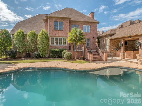 a view of a house with swimming pool