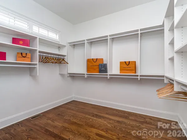 a view of utility room with racks on the wall