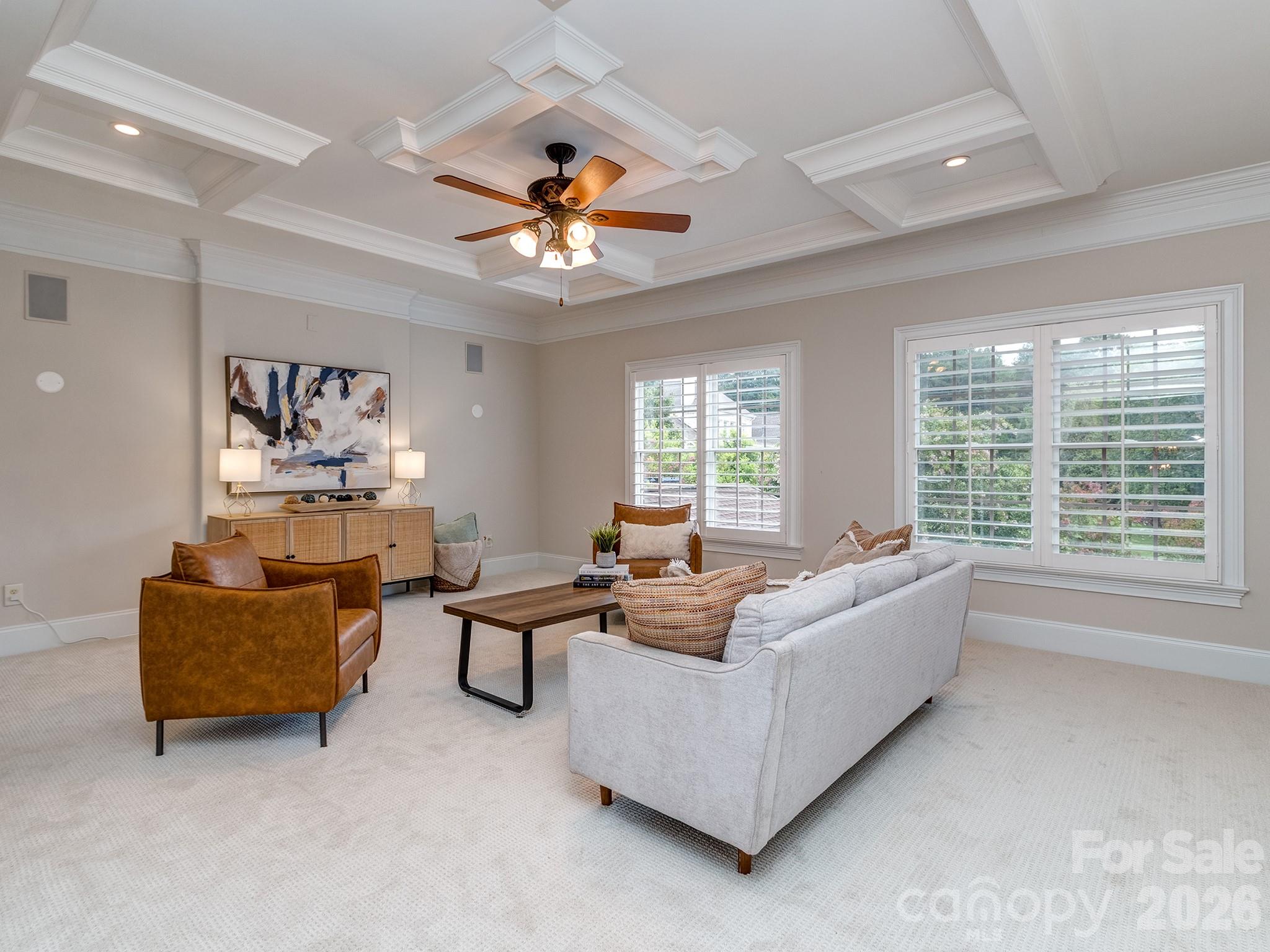 8208 Wingard Road Waxhaw, NC 28173 - Photo 23 of 41 a living room with furniture ceiling fan and a window
