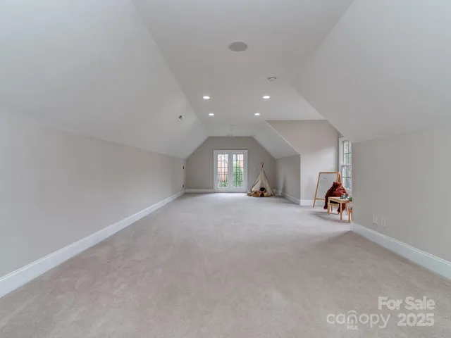 a view of a livingroom with fireplace and window