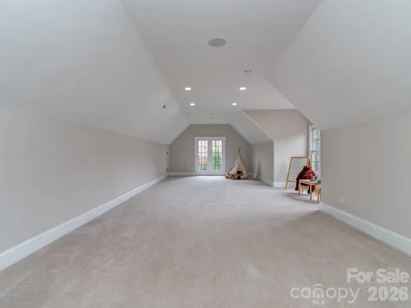 a view of a livingroom with fireplace and window