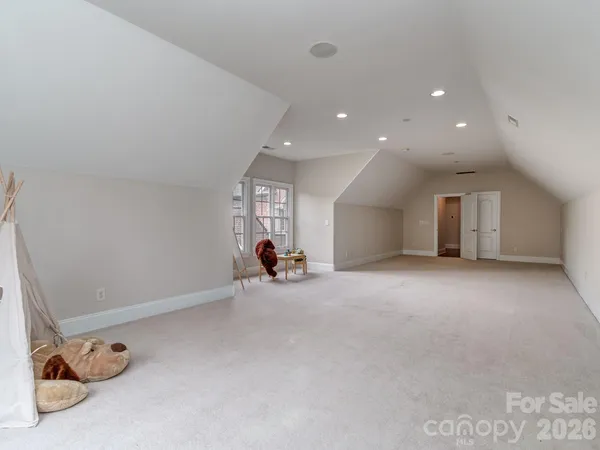 an empty room with furniture and a window