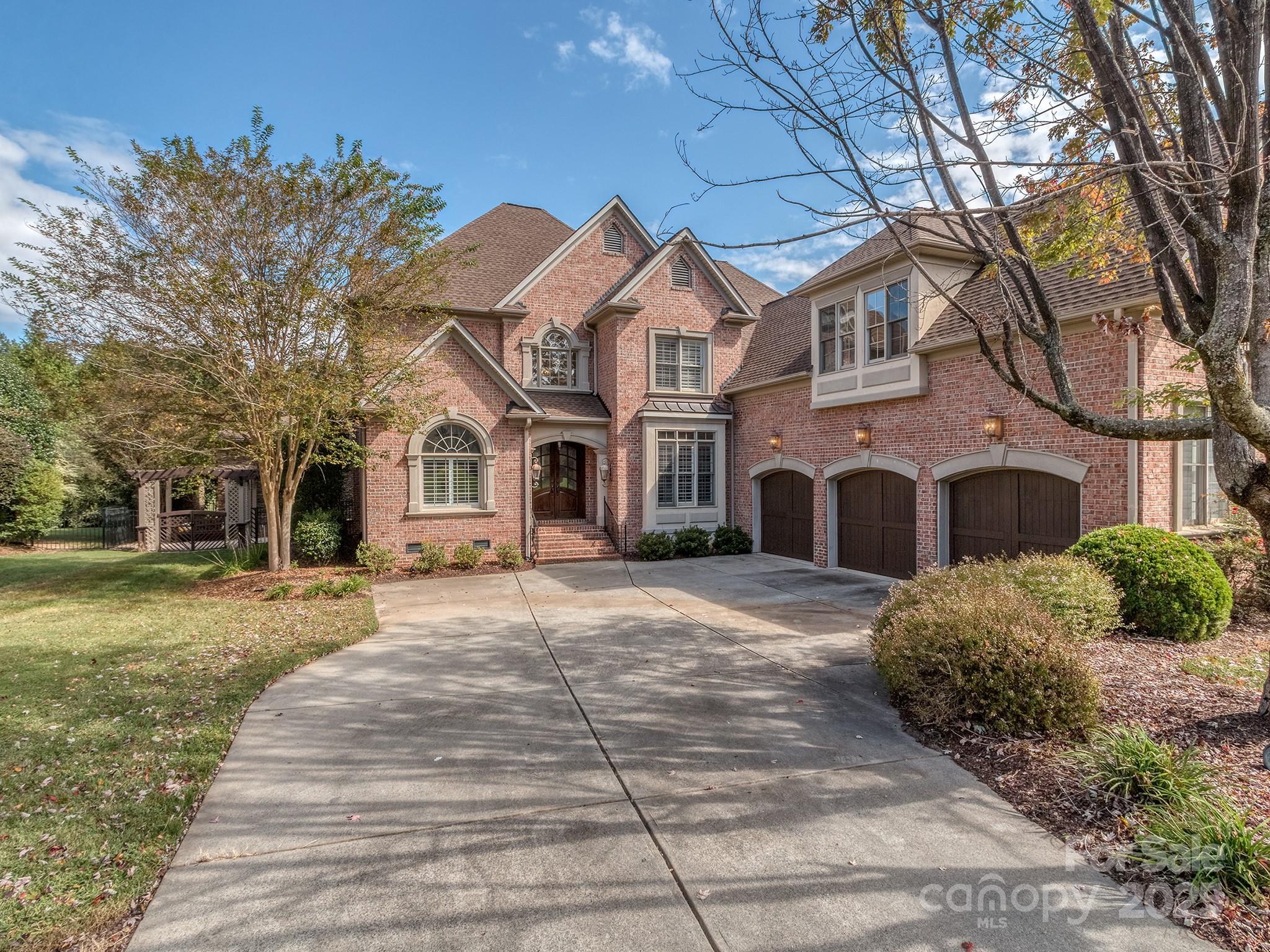 8208 Wingard Road Waxhaw, NC 28173 - Photo 35 of 41 a front view of a house with a yard and garage