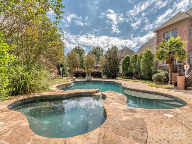a view of a swimming pool with a sitting space