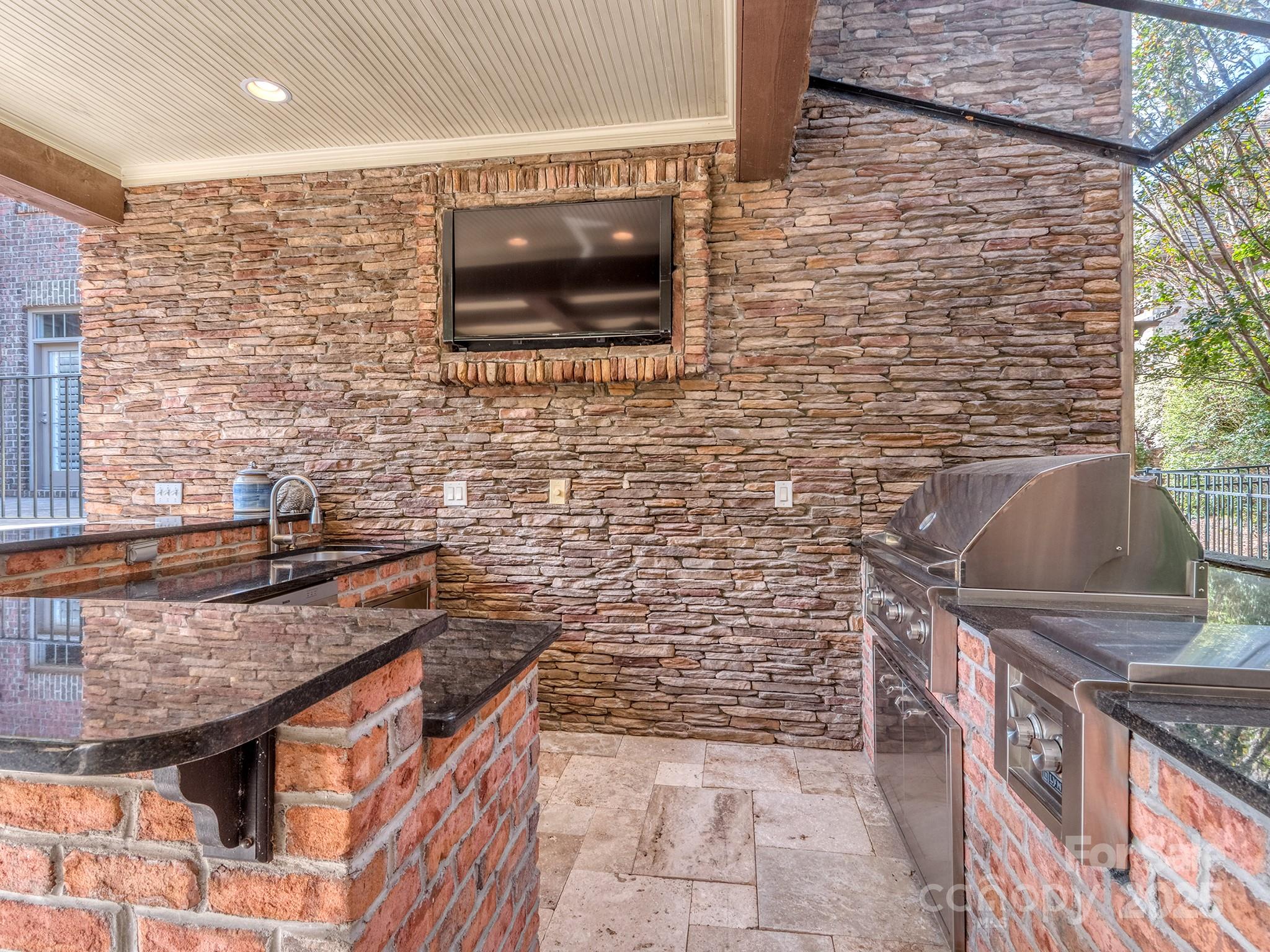 8208 Wingard Road Waxhaw, NC 28173 - Photo 4 of 41 a bathroom with a granite countertop sink a toilet and a shower