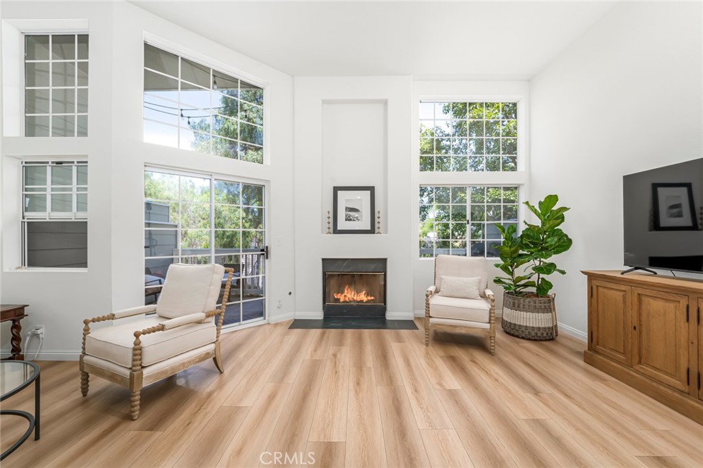 33144 Ocean Ridge Dana Point, CA 92629 - Photo 17 of 45 a living room with furniture fireplace and window
